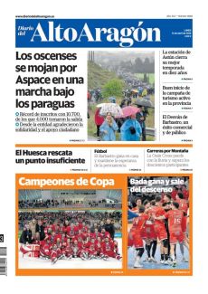 LOS OSCENSES SE MOJAN POR ASPACE EN UNA MARCHA BAJO LOS PARAGUAS